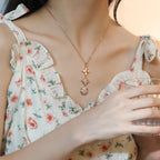 [Cyra] KETTE MIT STERN- UND SONNENDIAMANT IN ROSÉGOLD