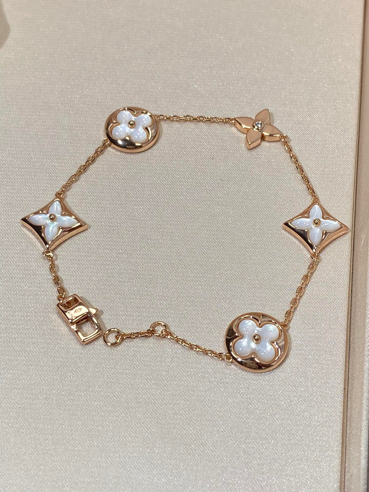 [Cyra]  STAR AND SUN 5 MOTIF MOP PINK GOLD BRACELET
