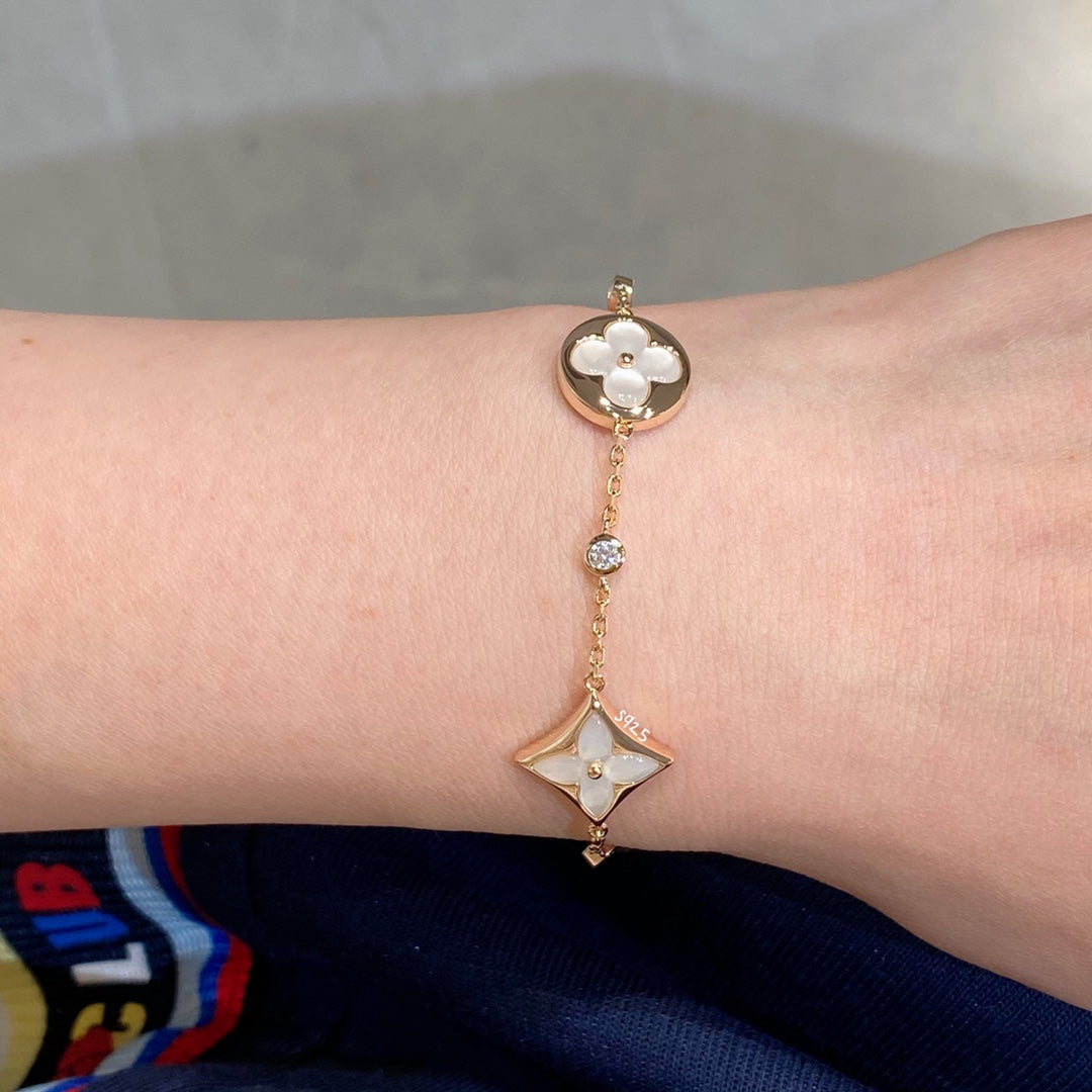 [Cyra]  STAR AND SUN 4 MOTIF WHITE MOP PINK GOLD BRACELET