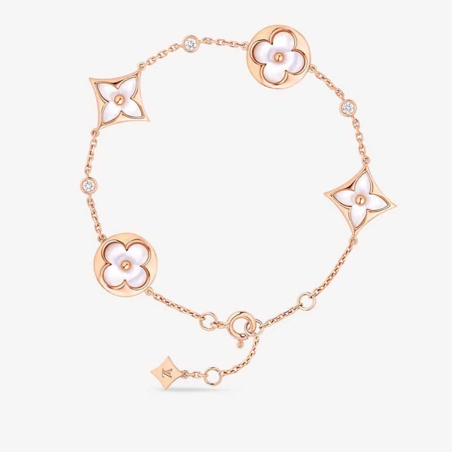 [Cyra]  STAR AND SUN 4 MOTIF WHITE MOP PINK GOLD BRACELET