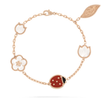 {
  "Cyra": "ラッキー スプリング ブレスレット、5モチーフ"
}