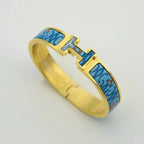 [Cyra] H-ARMBAND BLAU MEHRFARBIG