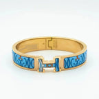 [Cyra] H-ARMBAND BLAU MEHRFARBIG
