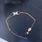 {
  "Cyra": "JEUX ARMBAND WEISSES PERLMUTT ROSÉGOLD 1 DIAMANT"
}