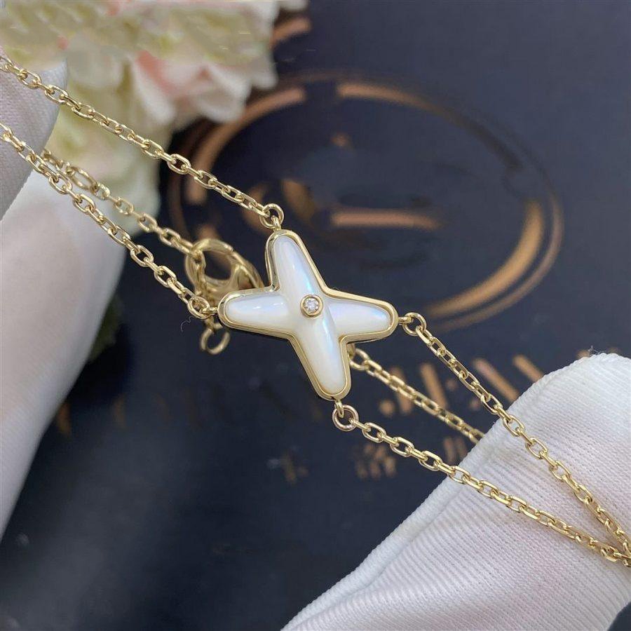 [Cyra]  JEUX ARMBAND WEISSE PERLMUTT GOLD 1 DIAMANT