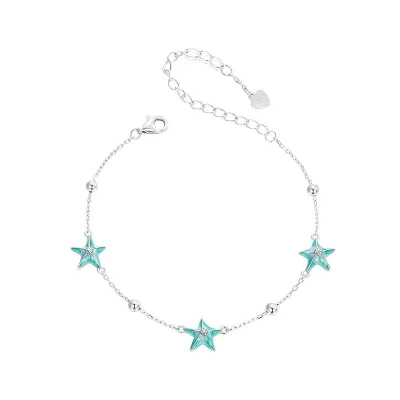 Gliederarmbänder mit blau-grünem Farbverlauf und Seestern-Motiv